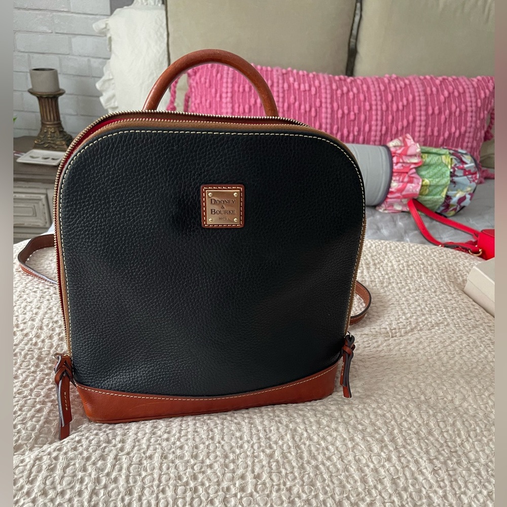 SOLD SOLD.  Dooney & Bourke backpack purse. Leather blue and brown